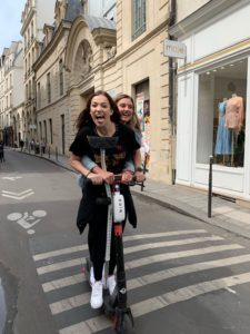 This photo shows me and my friend scootering around Paris. 