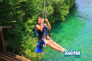 This is a picture of me zip lining. You can see how clear the water is underneath me and how green everything is around me. 
