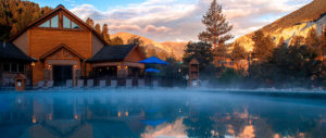 Buena Vista, Colorado's Mt. Princeton hot springs smoke with a resort and mountains in the background